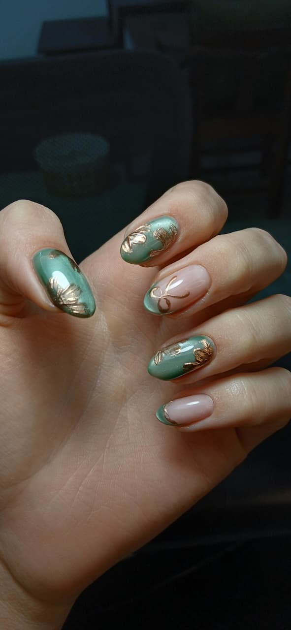 Soft green and nude manicure with sculpted gold details